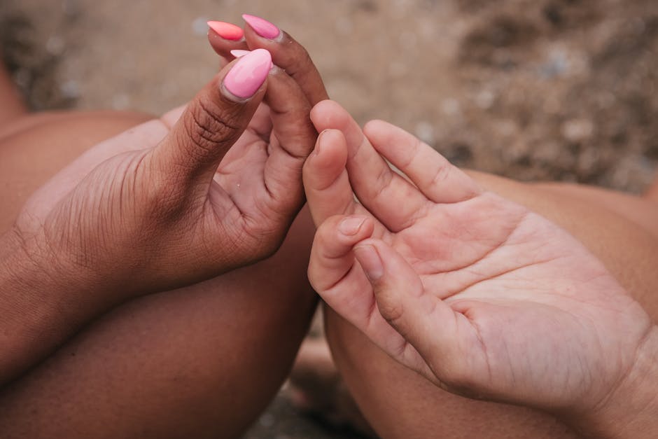 Close-up of a person's hands in a yoga mudra gesture, focus on fingers